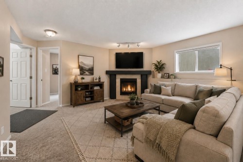 2050 Tanner Wynd Nw, Edmonton, AB - Indoor Photo Showing Living Room With Fireplace