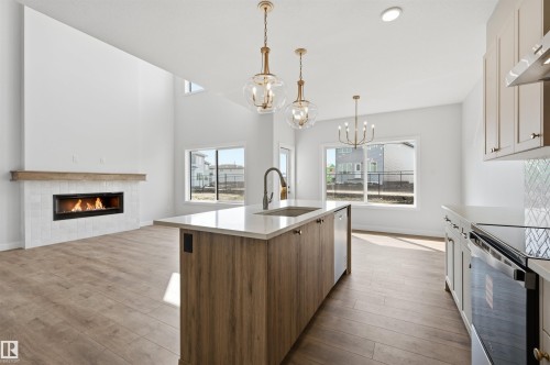 911 18 Avenue Nw, Edmonton, AB - Indoor Photo Showing Kitchen With Fireplace With Upgraded Kitchen