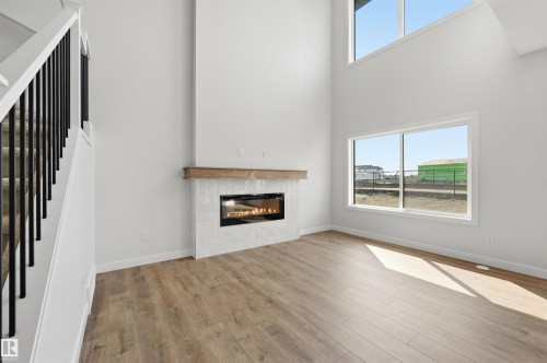 911 18 Avenue Nw, Edmonton, AB - Indoor Photo Showing Other Room With Fireplace