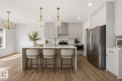 virtually staged - 911 18 Avenue Nw, Edmonton, AB - Indoor Photo Showing Kitchen With Stainless Steel Kitchen With Upgraded Kitchen