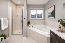 Corner soaking tub with tile surround, separate enclosed shower, and a single window for natural light - 