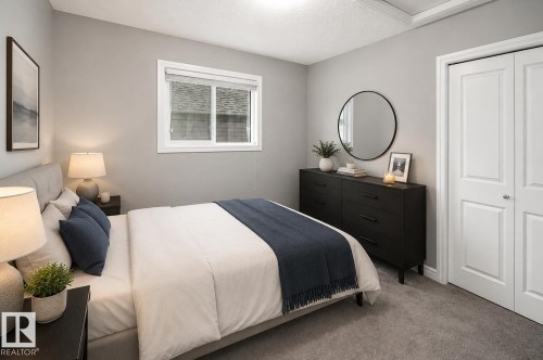 Carpeted flooring, neutral wall color, white trim, and a window with blinds - 16015 11 Avenue Sw, Edmonton, AB - Indoor Photo Showing Bedroom