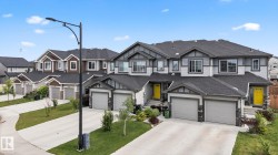 Contemporary multi-story facade featuring mixed siding, prominent gables, and multiple two-car garages - 