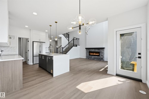 935 18 Avenue Nw, Edmonton, AB - Indoor Photo Showing Kitchen With Fireplace