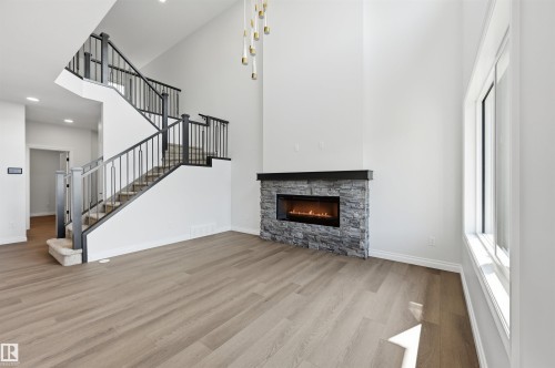 935 18 Avenue Nw, Edmonton, AB - Indoor Photo Showing Living Room With Fireplace