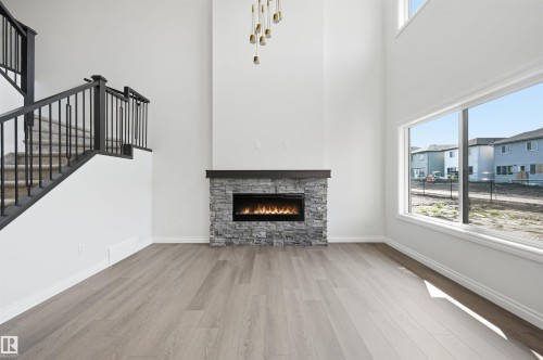 935 18 Avenue Nw, Edmonton, AB - Indoor Photo Showing Living Room With Fireplace
