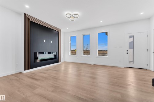 3618 39 Avenue, Beaumont, AB - Indoor Photo Showing Living Room With Fireplace