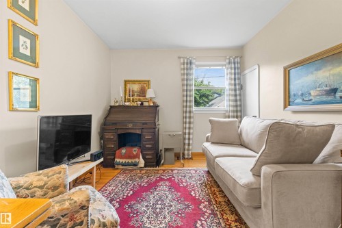 8842 89 Street Nw, Edmonton, AB - Indoor Photo Showing Living Room With Fireplace