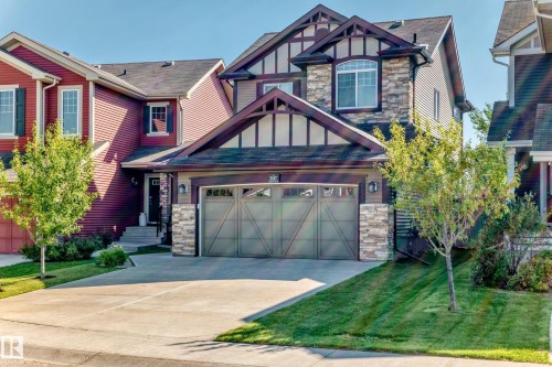 Stone and siding exterior with decorative gable trusses - 5147 Crabapple Link Sw, Edmonton, AB - Outdoor With Facade