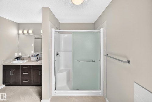 Walk-in shower with frosted glass enclosure - 5147 Crabapple Link Sw, Edmonton, AB - Indoor Photo Showing Bathroom