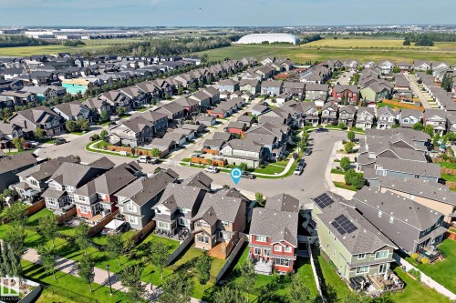 Residential neighborhood with varied architectural styles, featuring established streets and green spaces - 5147 Crabapple Link Sw, Edmonton, AB - Outdoor With View