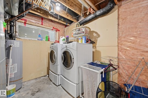 Laundry area in lower level - 1516 76 Street Sw, Edmonton, AB - Indoor Photo Showing Laundry Room