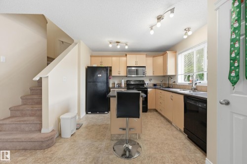 1516 76 Street Sw, Edmonton, AB - Indoor Photo Showing Living Room With Fireplace