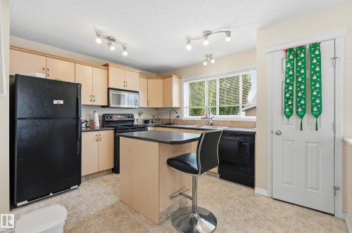 1516 76 Street Sw, Edmonton, AB - Indoor Photo Showing Living Room With Fireplace