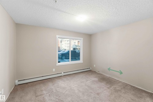 Carpeted room featuring a single window and neutral wall paint - #114 2207 44 Av Nw, Edmonton, AB - Indoor Photo Showing Other Room