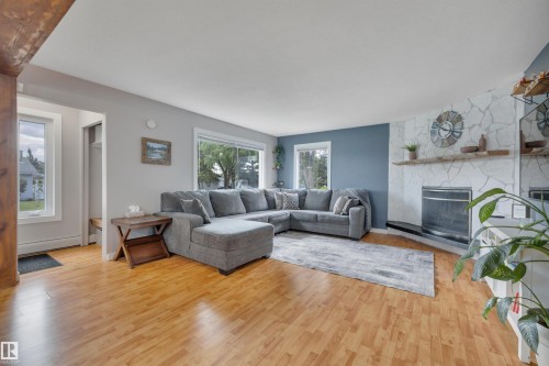 5116 47 Avenue, Leduc, AB - Indoor Photo Showing Living Room With Fireplace