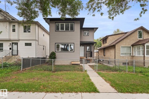 Modern two-story exterior with light gray siding and black trim windows - 10825 93 Street Nw, Edmonton, AB - Outdoor