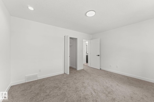 Neutral tone interior with recessed lighting and a flush mount fixture - 10825 93 Street Nw, Edmonton, AB - Indoor Photo Showing Other Room
