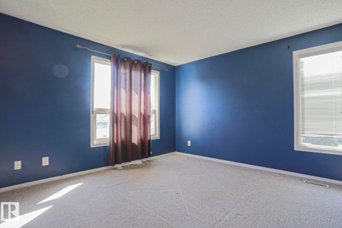 Wall-to-wall carpeting and multiple windows - #45 1651 46 St Nw, Edmonton, AB - Indoor Photo Showing Other Room