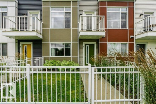 Contemporary multi-unit exterior with individual balconies featuring metal railings - #6 215 Saddleback Rd Nw, Edmonton, AB - Outdoor With Exterior