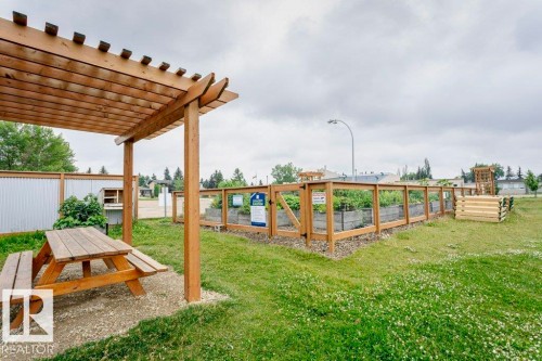 Wooden pergola with an exposed beam structure - #6 215 Saddleback Rd Nw, Edmonton, AB - Outdoor