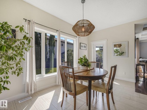 Lots of space for family dinners. Access to deck for BBQ'S is just off the dining area - 30 Shorewood Crescent, Leduc, AB - Indoor Photo Showing Dining Room
