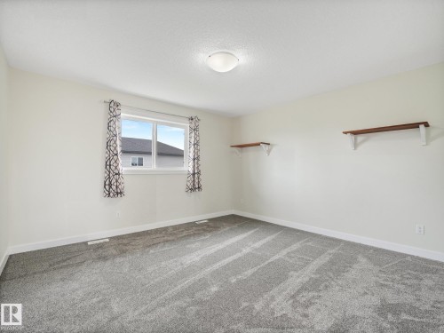 new carpets, fresh paint - 30 Shorewood Crescent, Leduc, AB - Indoor Photo Showing Other Room
