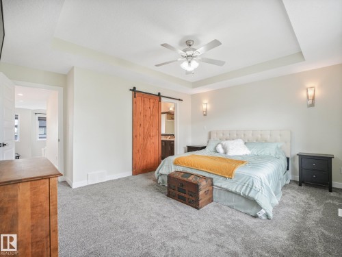 Coffered ceiling, fresh paint, new carpets and plenty of room for the King Size Bed - 30 Shorewood Crescent, Leduc, AB - Indoor Photo Showing Bedroom