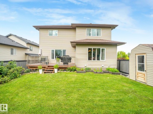 Raised garden beds, raspberries, an apple tree and lots of room for the kids to play!! - 30 Shorewood Crescent, Leduc, AB - Outdoor With Deck Patio Veranda With Exterior
