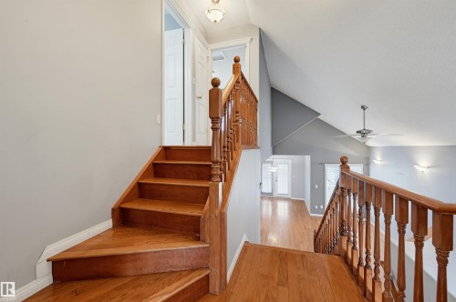 Hardwood stairs and railing with vaulted ceilings, recessed lighting, and a ceiling fan - #8 1920 Millwoods Rd E Nw, Edmonton, AB - Indoor Photo Showing Other Room