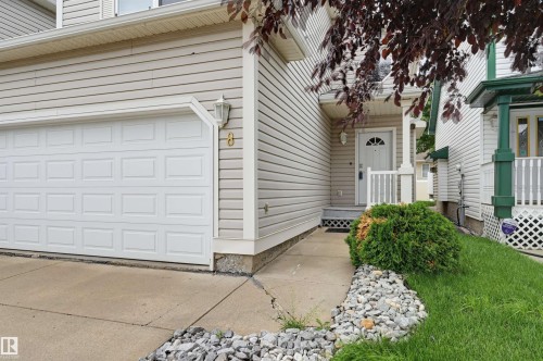 Attached single-car garage and concrete driveway - #8 1920 Millwoods Rd E Nw, Edmonton, AB - Outdoor