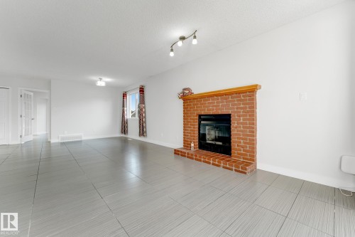 4511 25 Avenue Nw, Edmonton, AB - Indoor Photo Showing Living Room With Fireplace