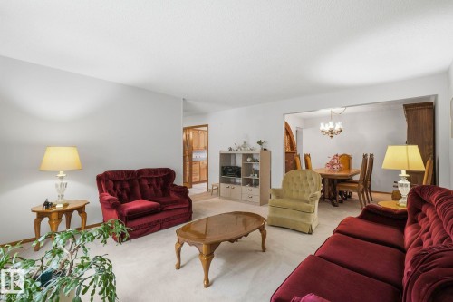 Expansive living area with soft carpet flooring and neutral wall tones - 7 Graham Avenue, St. Albert, AB - Indoor Photo Showing Living Room