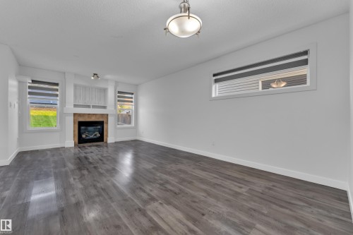 73 Hartwick Loop, Spruce Grove, AB - Indoor Photo Showing Living Room With Fireplace