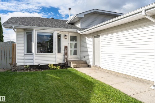 White siding exterior with a dark shingle roof - 4521 29 Avenue Nw, Edmonton, AB - Outdoor