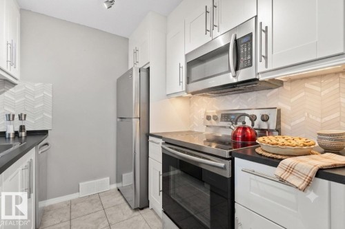 #210 2508 50 St Nw, Edmonton, AB - Indoor Photo Showing Kitchen With Stainless Steel Kitchen