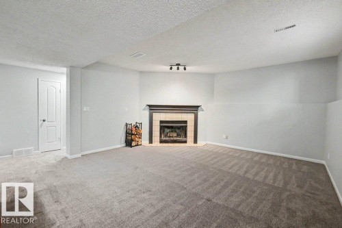 10 Oakridge Drive, St. Albert, AB - Indoor Photo Showing Living Room With Fireplace