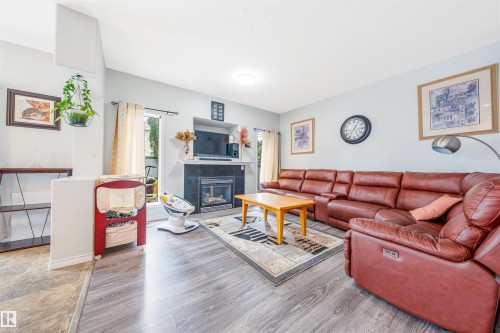 37 Birchmont Crescent, Leduc, AB - Indoor Photo Showing Living Room With Fireplace