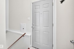 Panel-style entry door with chrome hardware - 