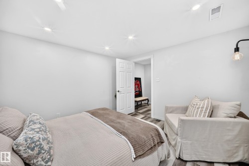 Recessed ceiling lighting, white interior walls, white trim, and wood-finish flooring - 16406 87A Avenue Nw, Edmonton, AB - Indoor Photo Showing Bedroom