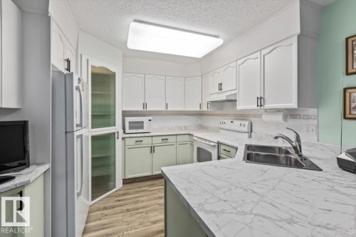 #307 45 Gervais Rd, St. Albert, AB - Indoor Photo Showing Kitchen With Double Sink