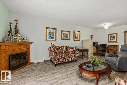 #307 45 Gervais Rd, St. Albert, AB - Indoor Photo Showing Living Room With Fireplace