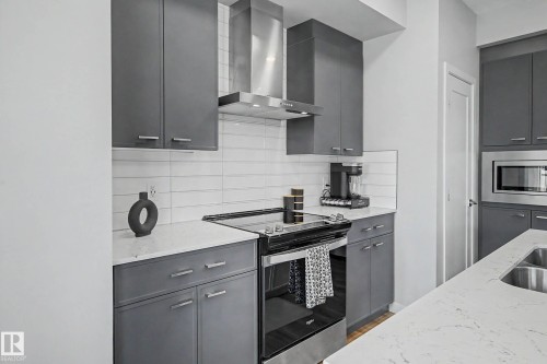 97 Garneau Gate, Spruce Grove, AB - Indoor Photo Showing Kitchen With Double Sink