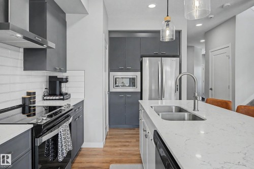 97 Garneau Gate, Spruce Grove, AB - Indoor Photo Showing Kitchen With Double Sink With Upgraded Kitchen