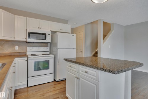 #1 5101 Soleil Bv, Beaumont, AB - Indoor Photo Showing Kitchen