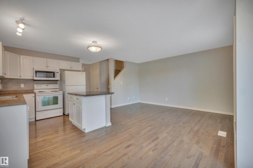 #1 5101 Soleil Bv, Beaumont, AB - Indoor Photo Showing Kitchen