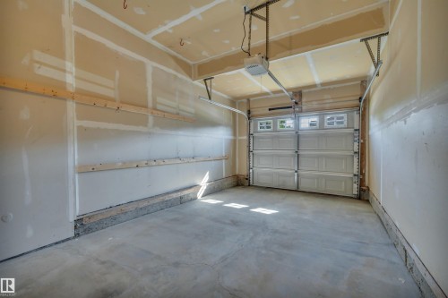 #1 5101 Soleil Bv, Beaumont, AB - Indoor Photo Showing Garage