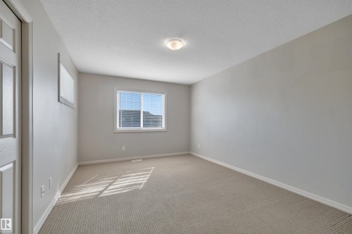#1 5101 Soleil Bv, Beaumont, AB - Indoor Photo Showing Other Room