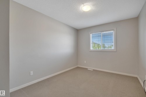 #1 5101 Soleil Bv, Beaumont, AB - Indoor Photo Showing Other Room