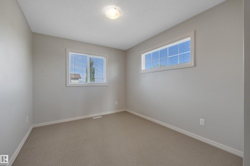 #1 5101 Soleil Bv, Beaumont, AB - Indoor Photo Showing Other Room